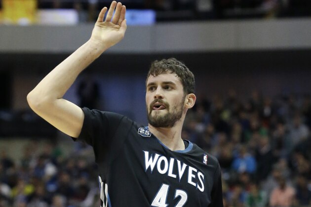 Minnesota Timberwolves forward Kevin Love (42) watches his shot during the first half an NBA basketball game against the Dallas Mavericks Wednesday, March 19, 2014, in Dallas. (AP Photo/LM Otero)