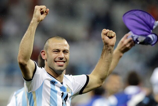 Argentina's Javier Mascherano celebrates after Argentina defeated the Netherlands 4-2 in a penalty shootout after a 0-0 tie after extra time to advance to the finals during the World Cup semifinal soccer match between the Netherlands and Argentina at the Itaquerao Stadium in Sao Paulo Brazil, Wednesday, July 9, 2014. (AP Photo/Victor R. Caivano)