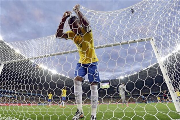 AP10ThingsToSee - Brazil's Fernandinho reacts after Germany's Toni Kroosduring scored his side's third goal during the World Cup semifinal soccer match between Brazil and Germany at the Mineirao Stadium in Belo Horizonte, Brazil, Tuesday, July 8, 2014. (AP Photo/Natacha Pisarenko)