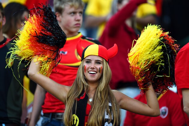 SAO PAULO, BRAZIL - JUNE 26:  A Belgium fan cheers during the 2014 FIFA World Cup Brazil Group H match between South Korea and Belgium at Arena de Sao Paulo on June 26, 2014 in Sao Paulo, Brazil.  (Photo by Stu Forster/Getty Images)