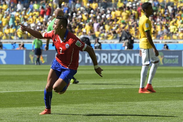 Chile's Alexis Sanchez celebrates after scoring his side's first goal during the World Cup round of 16 soccer match between Brazil and Chile at the Mineirao Stadium in Belo Horizonte, Brazil, Saturday, June 28, 2014. (AP Photo/Manu Fernandez)