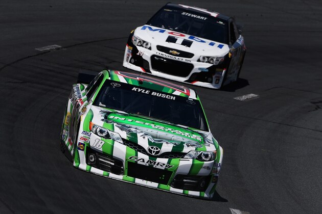 LOUDON, NH - JULY 11:  Kyle Busch, driver of the #18 Interstate Batteries Toyota, leads Tony Stewart, driver of the #14 Mobil 1 Chevrolet, during practice for the NASCAR Sprint Cup Series Camping World RV Sales 301 at New Hampshire Motor Speedway on July 11, 2014 in Loudon, New Hampshire.  (Photo by Nick Laham/Getty Images)