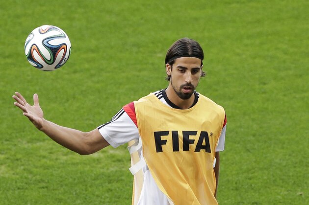 German national soccer player Sami Khedira joggles a ball during an official training session one day before the World Cup semifinal soccer match between Brazil and Germany at the Mineirao Stadium in Belo Horizonte, Brazil, Monday, July 7, 2014. (AP Photo/Matthias Schrader)