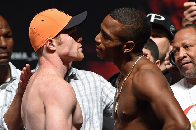 LAS VEGAS, NV - JULY 11:  Boxers Canelo Alvarez (L) and Erislandy Lara face off during their official weigh-in at the MGM Grand Garden Arena on July 11, 2014 in Las Vegas, Nevada. The two will meet in a non-title bout on July 12.  (Photo by Ethan Miller/Getty Images)