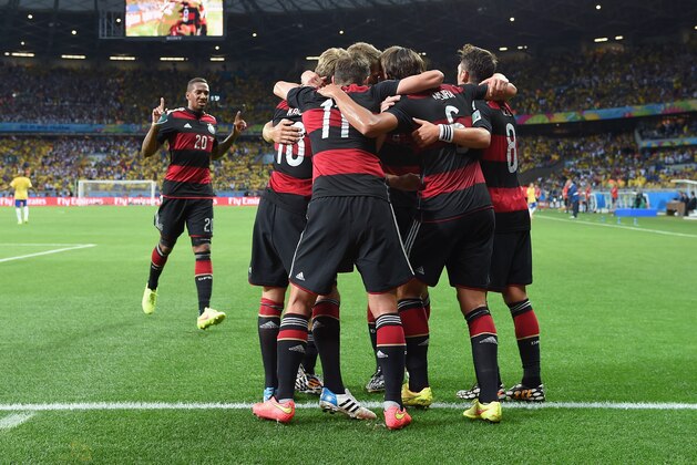 BELO HORIZONTE, BRAZIL - JULY 08: Toni Kroos of Germany celebrates scoring his team's fourth goal with his team-mates during the 2014 FIFA World Cup Brazil Semi Final match between Brazil and Germany at Estadio Mineirao on July 8, 2014 in Belo Horizonte, Brazil.  (Photo by Buda Mendes/Getty Images)