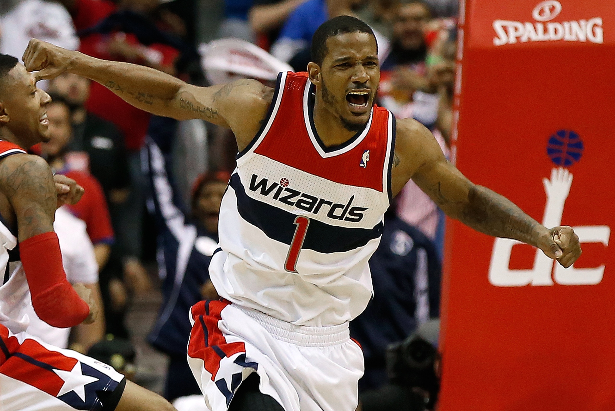 WASHINGTON, DC - APRIL 27:  Trevor Ariza #1 of the Washington Wizards celebrates after scoring a key basket late in the fourth quarter against the Chicago Bulls in Game Four of the Eastern Conference Quarterfinals during the 2014 NBA Playoffs at the Verizon Center on April 27, 2014 in Washington, DC. Washington won the game 98-89. NOTE TO USER: User expressly acknowledges and agrees that, by downloading and or using this photograph, User is consenting to the terms and conditions of the Getty Images License Agreement.  (Photo by Win McNamee/Getty Images)