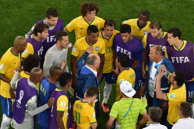 Brazil's coach Luiz Felipe Scolari talks to his players after the World Cup semifinal soccer match between Brazil and Germany at the Mineirao Stadium in Belo Horizonte, Brazil, Tuesday, July 8, 2014. Germany has routed host Brazil 7-1 and advanced to the final of the World Cup. (AP Photo/Felipe Dana, Pool)