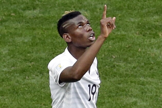 France's Paul Pogba celebrates after scoring the opening goal during the World Cup round of 16 soccer match between France and Nigeria at the Estadio Nacional in Brasilia, Brazil, Monday, June 30, 2014. (AP Photo/Hassan Ammar)