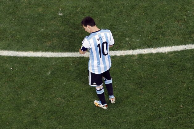 Argentina's Lionel Messi looks down during the World Cup semifinal soccer match between the Netherlands and Argentina at the Itaquerao Stadium in Sao Paulo, Brazil, Wednesday, July 9, 2014. (AP Photo/Fabrizio Bensch, Pool)