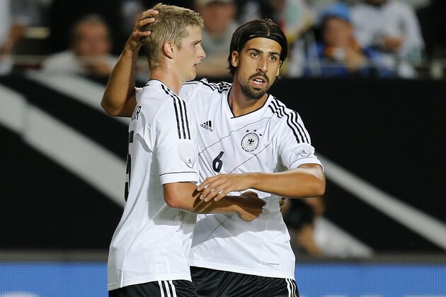 Germany's Lars Bender, left, and Sami Khedira celebrate Bender's equalizing goal during a friendly soccer match between Germany and Paraguay in Kaiserslautern, Germany, Wednesday, Aug. 14, 2013. (AP Photo/Michael Probst)