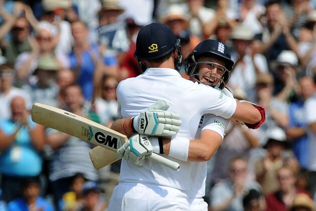 England's Joe Root, right, celebrates with James Anderson after reaching a century during day four of the first test between England and India at Trent Bridge cricket ground in Nottingham, England, Saturday, July 12, 2014. (AP Photo/Rui Vieira) England's Joe Root, right, celebrates with James Anderson after reaching a century during day four of the first test between England and India at Trent Bridge cricket ground in Nottingham, England, Saturday, July 12, 2014. (AP Photo/Rui Vieira)