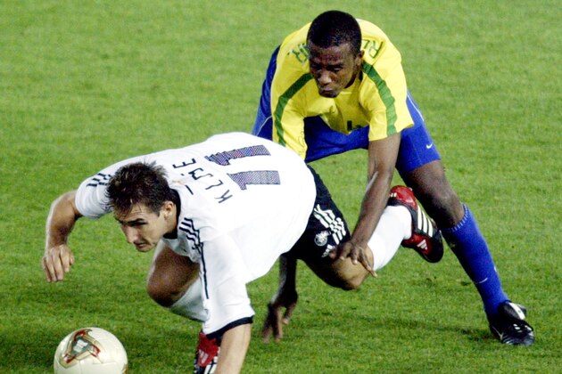 Germany's Miroslav Klose (11) and Brazil's Roque Junior battle for the ball during the 2002 World Cup final Sunday, June 30, 2002, in Yokohama, Japan. (AP Photo/David Guttenfelder)