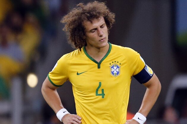 Brazil's David Luiz reacts after Germany scored their fifth goal during the World Cup semifinal soccer match between Brazil and Germany at the Mineirao Stadium in Belo Horizonte, Brazil, Tuesday, July 8, 2014. (AP Photo/Frank Augstein)