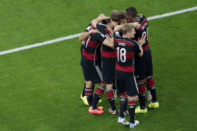 German players celebrates after Sami Khedira scored his side's fifth goal during the World Cup semifinal soccer match between Brazil and Germany at the Mineirao Stadium in Belo Horizonte, Brazil, Tuesday, July 8, 2014. (AP Photo/Felipe Dana, Pool)