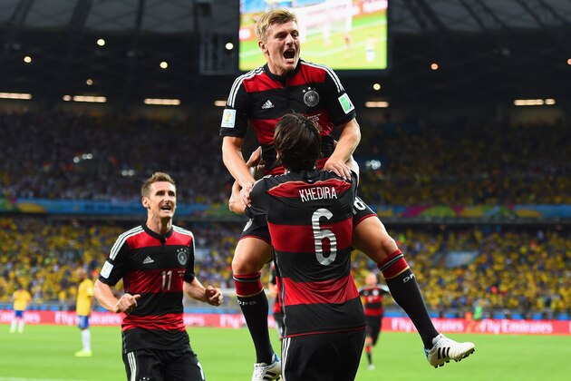 BELO HORIZONTE, BRAZIL - JULY 08: Toni Kroos of Germany celebrates scoring his team's fourth goal with teammates Miroslav Klose (L) and Sami Khedira during the 2014 FIFA World Cup Brazil Semi Final match between Brazil and Germany at Estadio Mineirao on July 8, 2014 in Belo Horizonte, Brazil.  (Photo by Buda Mendes/Getty Images)