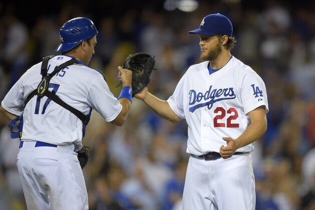Los Angeles Dodgers starting pitcher Clayton Kershaw, right, is congratulated by catcher A.J. Ellis after they defeated the San Diego Padres 2-1 in a baseball game on Thursday, July 10, 2014, in Los Angeles. (AP Photo/Mark J. Terrill) Los Angeles Dodgers starting pitcher Clayton Kershaw, right, is congratulated by catcher A.J. Ellis after they defeated the San Diego Padres 2-1 in a baseball game on Thursday, July 10, 2014, in Los Angeles. (AP Photo/Mark J. Terrill)