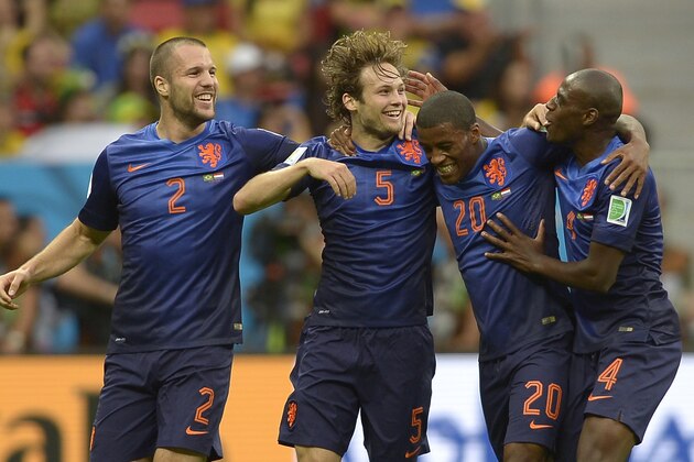 Netherlands' Daley Blind, second left, celebrates after scoring his side's second goal during the World Cup third-place soccer match between Brazil and the Netherlands at the Estadio Nacional in Brasilia, Brazil, Saturday, July 12, 2014.  (AP Photo/Manu Fernandez)