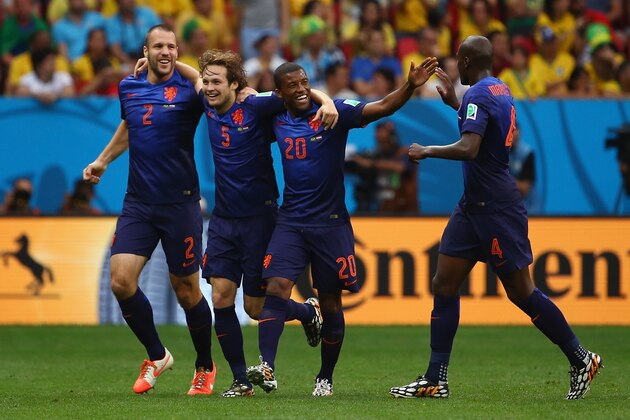 BRASILIA, BRAZIL - JULY 12:  Daley Blind of the Netherlands (2nd L) celebrates scoring his team's second goal with Ron Vlaar (L), Georginio Wijnaldum (2nd R) and Bruno Martins Indi during the 2014 FIFA World Cup Brazil Third Place Playoff match between Brazil and the Netherlands at Estadio Nacional on July 12, 2014 in Brasilia, Brazil.  (Photo by Robert Cianflone/Getty Images)