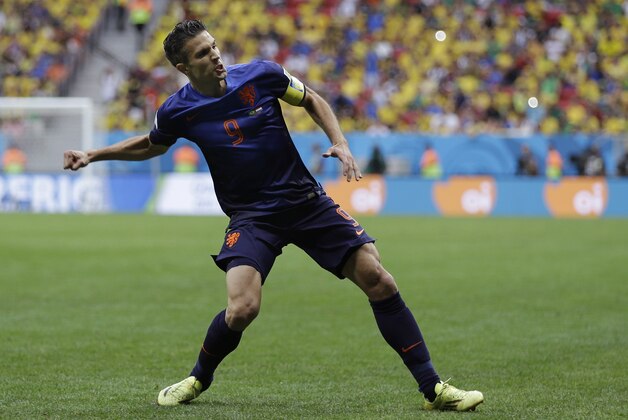 Netherlands' Robin van Persie celebrates after scoring his team's first goal on a penalty shot during the World Cup third-place soccer match between Brazil and the Netherlands at the Estadio Nacional in Brasilia, Brazil, Saturday, July 12, 2014. (AP Photo/Natacha Pisarenko)