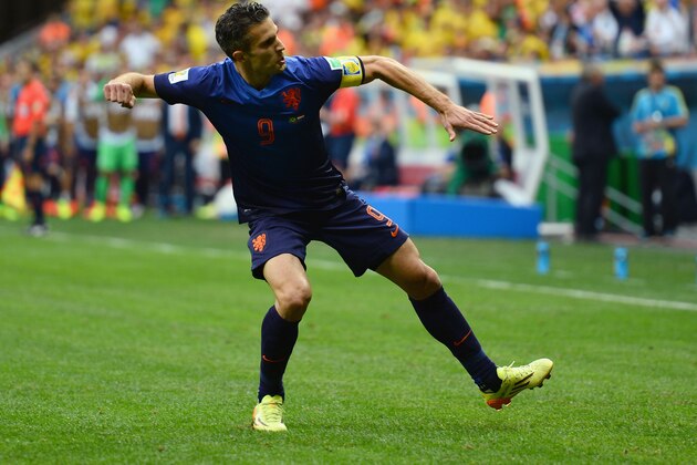 BRASILIA, BRAZIL - JULY 12:  Robin van Persie of the Netherlands celebrates scoring  his team's first goal on a penalty kick during the 2014 FIFA World Cup Brazil Third Place Playoff match between Brazil and the Netherlands at Estadio Nacional on July 12, 2014 in Brasilia, Brazil.  (Photo by Jamie McDonald/Getty Images)