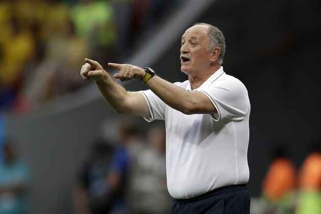 Brazil's coach Luiz Felipe Scolari gives directions to his team during the World Cup third-place soccer match between Brazil and the Netherlands at the Estadio Nacional in Brasilia, Brazil, Saturday, July 12, 2014. (AP Photo/Natacha Pisarenko)