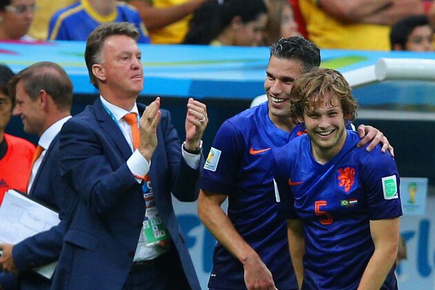 BRASILIA, BRAZIL - JULY 12: Daley Blind of the Netherlands (R) celebrates scoring his team's second goal with Robin van Persie and head coach Louis van Gaal during the 2014 FIFA World Cup Brazil Third Place Playoff match between Brazil and the Netherlands at Estadio Nacional on July 12, 2014 in Brasilia, Brazil.  (Photo by Dean Mouhtaropoulos/Getty Images)