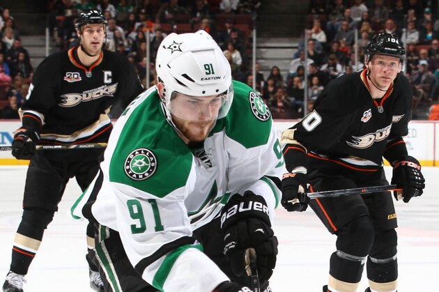 ANAHEIM, CA - FEBRUARY 1:  Tyler Seguin #91 of the Dallas Stars controls the puck ahead of Cam Fowler #4, Ryan Getzlaf #15, and Corey Perry #10 of the Anaheim Ducks at Honda Center on February 1, 2014 in Anaheim, California. (Photo by Debora Robinson/NHLI via Getty Images)