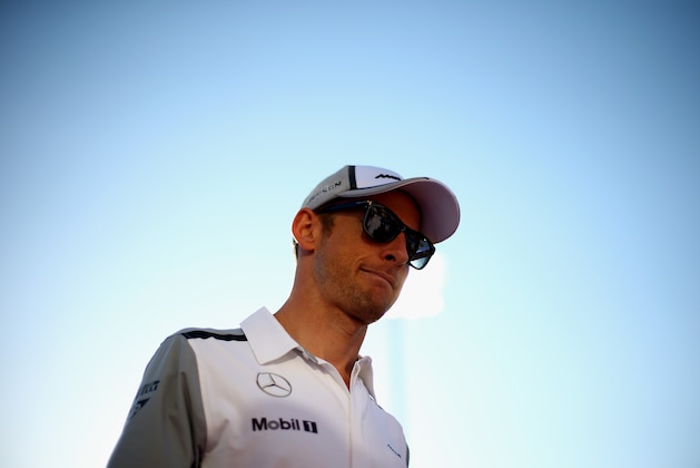 SAKHIR, BAHRAIN - APRIL 06:  Jenson Button of Great Britain and McLaren attends the drivers parade before the Bahrain Formula One Grand Prix at the Bahrain International Circuit on April 6, 2014 in Sakhir, Bahrain.  (Photo by Paul Gilham/Getty Images)