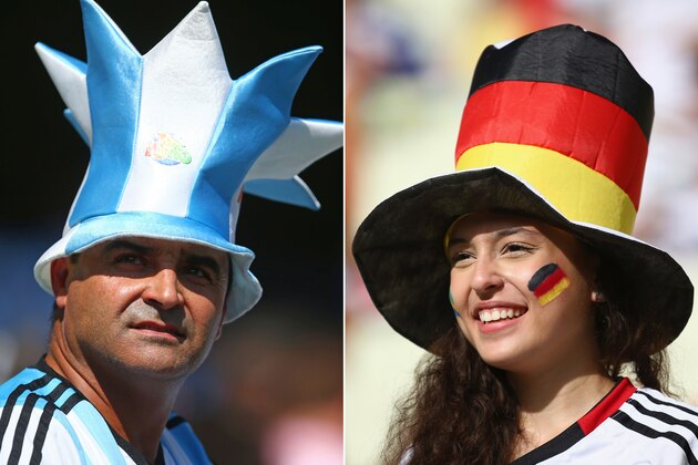 FILE PHOTO - EDITORS NOTE: COMPOSITE OF TWO IMAGES - Image Numbers 450985096 (L) and 450994202) In this composite image a comparison has been made between Argentina and Germany Fans. Germany and Argentina play each other in the 2014 FIFA World Cup Brazil Final on July 13, 2014 in the Maracana Stadium in Rio De Janeiro,Brazil. ***LEFT IMAGE*** BELO HORIZONTE, BRAZIL - JUNE 21: An Argentina fan enjoys the atmosphere prior to the 2014 FIFA World Cup Brazil Group F match between Argentina and Iran at Estadio Mineirao on June 21, 2014 in Belo Horizonte, Brazil. (Photo by Jeff Gross/Getty Images) ***RIGHT IMAGE***  FORTALEZA, BRAZIL - JUNE 21: A Germany fan enjoys the atmopshere prior to the 2014 FIFA World Cup Brazil Group G match between Germany and Ghana at Castelao on June 21, 2014 in Fortaleza, Brazil. (Photo by Robert Cianflone/Getty Images)