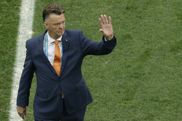 Netherlands' head coach Louis van Gaal waves as he leaves after inspecting the pitch before the World Cup semifinal soccer match between the Netherlands and Argentina at the Itaquerao Stadium in Sao Paulo Brazil, Wednesday, July 9, 2014. (AP Photo/Themba Hadebe)