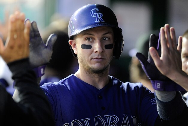 WASHINGTON, DC - JUNE 30:  Troy Tulowitzki #2 of the Colorado Rockies celebrates with teammates after scoring in the sixth inning against the Washington Nationals at Nationals Park on June 30, 2014 in Washington, DC.  (Photo by Greg Fiume/Getty Images)
