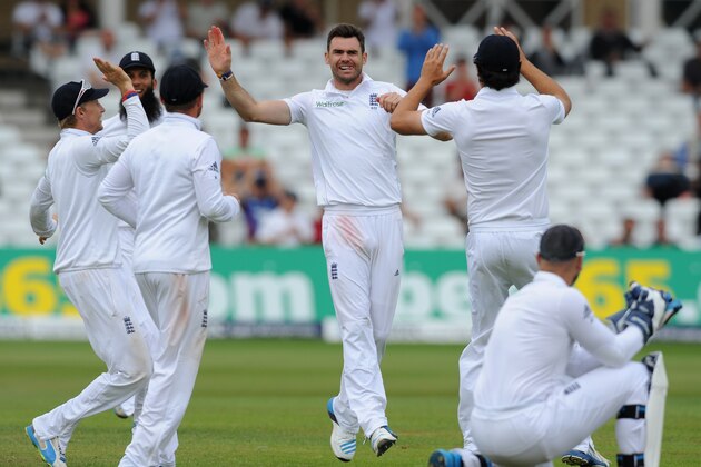 England's James Anderson, centre, celebrates after bowling India's Ravindra Jadeja caught Matt Prior, bottom right,  for 31 runs during day five of the first Test between England and India at Trent Bridge cricket ground, Nottingham, England, Sunday, July 13, 2014. (AP Photo/Rui Vieira)