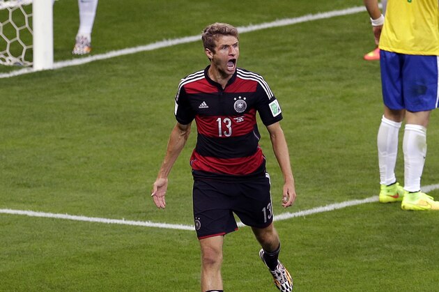 Germany's Thomas Mueller celebrates after scoring his teams first goal during the World Cup semifinal soccer match between Brazil and Germany at the Mineirao Stadium in Belo Horizonte, Brazil, Tuesday, July 8, 2014. (AP Photo/Themba Hadebe)