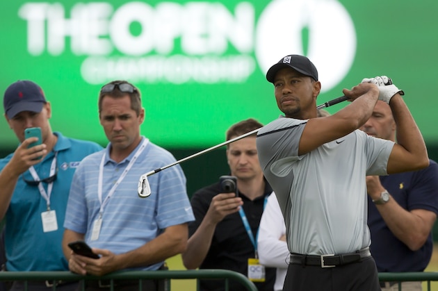 Tiger Woods of the US plays a shot off the 3rd tee during a practice round at the Royal Liverpool Golf Club prior to the start of the British Open Golf Championship, in Hoylake, England, Saturday, July 12, 2014. The 2014 Open Championship starts on Thursday, July 17. (AP Photo/Jon Super)
