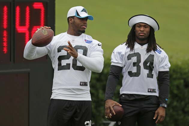 Carolina Panthers running backs Jonathan Stewart (28) and DeAngelo Williams (34) warm up during an NFL football training camp practice in Spartanburg, S.C., Tuesday, July 30, 2013. (AP Photo/Chuck Burton)