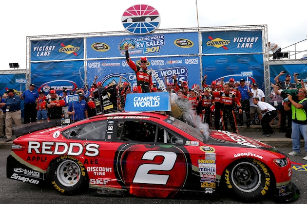 LOUDON, NH - JULY 13:  Brad Keselowski, driver of the #2 Redds Ford, celebrates in victory lane after winning the NASCAR Sprint Cup Series Camping World RV Sales 301 at New Hampshire Motor Speedway on July 13, 2014 in Loudon, New Hampshire.  (Photo by Jonathan Ferrey/Getty Images)
