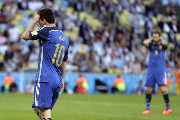 Argentina's Lionel Messi reacts after missing a scoring opportunity during the World Cup final soccer match between Germany and Argentina at the Maracana Stadium in Rio de Janeiro, Brazil, Sunday, July 13, 2014. (AP Photo/Felipe Dana)
