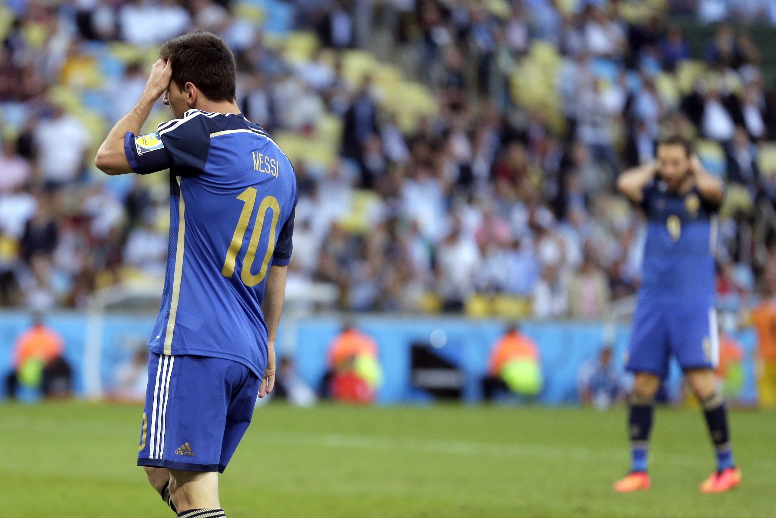 Argentina's Lionel Messi reacts after missing a scoring opportunity during the World Cup final soccer match between Germany and Argentina at the Maracana Stadium in Rio de Janeiro, Brazil, Sunday, July 13, 2014. (AP Photo/Felipe Dana)