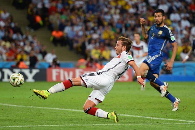 RIO DE JANEIRO, BRAZIL - JULY 13: Mario Goetze of Germany scores his team's first goal in extra time during the 2014 FIFA World Cup Brazil Final match between Germany and Argentina at Maracana on July 13, 2014 in Rio de Janeiro, Brazil.  (Photo by Jamie McDonald/Getty Images)