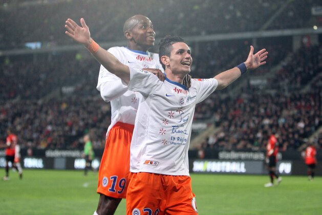 Montpellier's french forward Remy Cabella jubilates with Souleymane Camara after he scored the second goal against Rennes during his French League One soccer match in Rennes, western France, Monday, May 7, 2012. (AP Photo/David Vincent)
