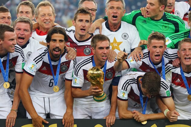 RIO DE JANEIRO, BRAZIL - JULY 13:  Germany celebrate with the World Cup trophy after defeating Argentina 1-0 in extra time during the 2014 FIFA World Cup Brazil Final match between Germany and Argentina at Maracana on July 13, 2014 in Rio de Janeiro, Brazil.  (Photo by Martin Rose/Getty Images)