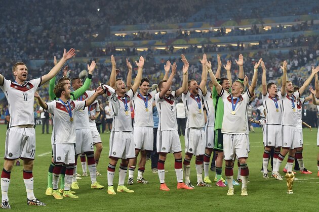 German players celebrate after the World Cup final soccer match between Germany and Argentina at the Maracana Stadium in Rio de Janeiro, Brazil, Sunday, July 13, 2014. Germany won the match 1-0. (AP Photo/Martin Meissner)
