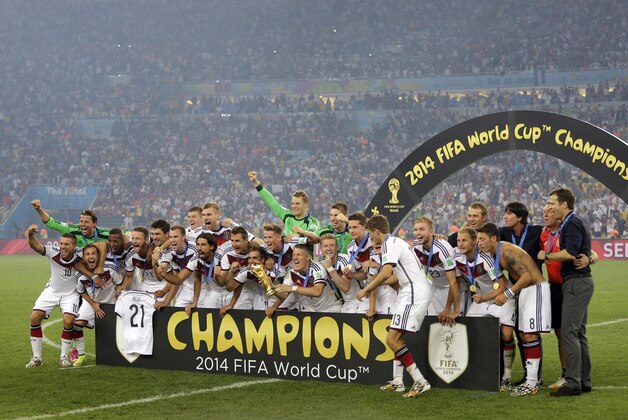 German players celebrate their 1-0 victory over Argentina after the World Cup final soccer match between Germany and Argentina at the Maracana Stadium in Rio de Janeiro, Brazil, Sunday, July 13, 2014. (AP Photo/Natacha Pisarenko)