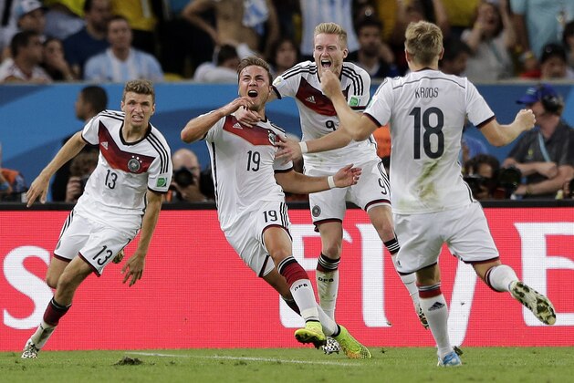Germany's Mario Goetze (19) celebrates after scoring the opening goal during the World Cup final soccer match between Germany and Argentina at the Maracana Stadium in Rio de Janeiro, Brazil, Sunday, July 13, 2014.  (AP Photo/Matthias Schrader)