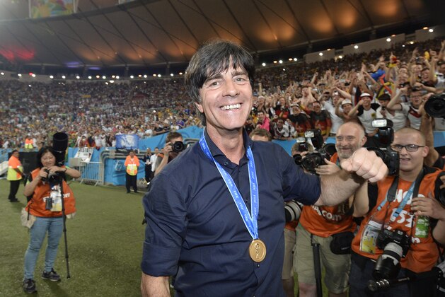 Germany's head coach Joachim Loew celebrates after the World Cup final soccer match between Germany and Argentina at the Maracana Stadium in Rio de Janeiro, Brazil, Sunday, July 13, 2014. Germany won the match 1-0. (AP Photo/Martin Meissner)