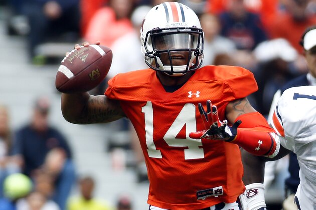 Auburn quarterback Nick Marshall (14) throws in the first half of the annual A Day spring inter squad college football game  Saturday, April 19, 2014 in Auburn, Ala.  (AP Photo/John Bazemore)