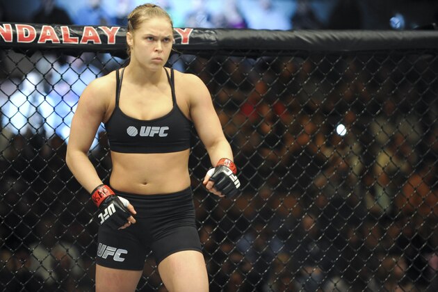 Feb 22, 2014; Las Vegas, NV, USA;  Ronda Rousey (red gloves) prior to the start of her fight against Sara McMann (blue gloves) for their UFC bantamweight championship bout at Mandalay Bay. Mandatory Credit: Stephen R. Sylvanie-USA TODAY Sports