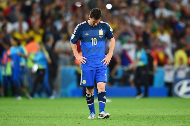 RIO DE JANEIRO, BRAZIL - JULY 13: A dejected Lionel Messi of Argentina reacts after being defeated by Germany 1-0 in extra time during the 2014 FIFA World Cup Brazil Final match between Germany and Argentina at Maracana on July 13, 2014 in Rio de Janeiro, Brazil.  (Photo by Matthias Hangst/Getty Images)