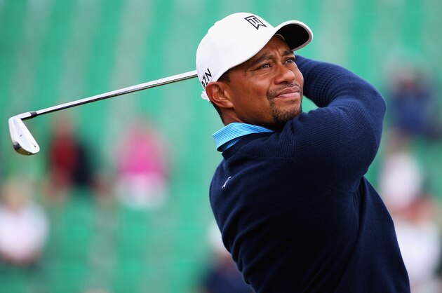 HOYLAKE, ENGLAND - JULY 13:  Tiger Woods of the USA tees off on the 4th hole during a practice round ahead of the 143rd Open Championship at Royal Liverpool on July 13, 2014 in Hoylake, England.  (Photo by Matthew Lewis/Getty Images)