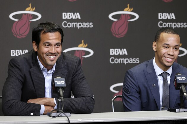 Miami Heat head coach Erik Spoelstra, left, and Shabazz Napier smile during a light moment during a news conference in Miami, Monday, June 30, 2014. The Heat acquired the draft rights to Connecticut guard Shabazz Napier in a trade with the Charlotte Hornets on Thursday night, giving up the 26th and 55th picks to make the deal happen, along with a future second-round choice and cash considerations. (AP Photo/Alan Diaz)